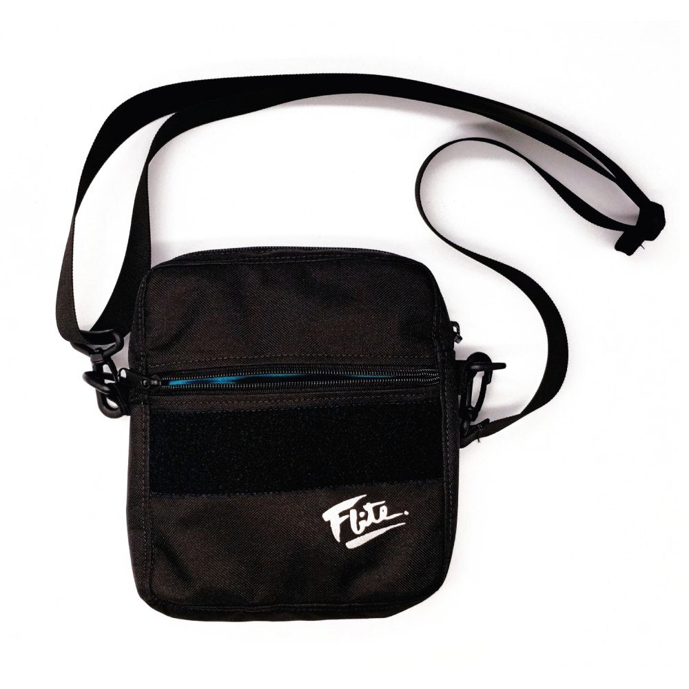 Black loop field on black cross body bag with flite reflective logo for men.  EDC bag